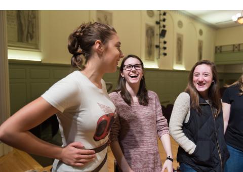 Three students laughing