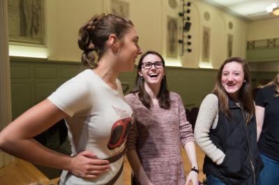 Three students laughing